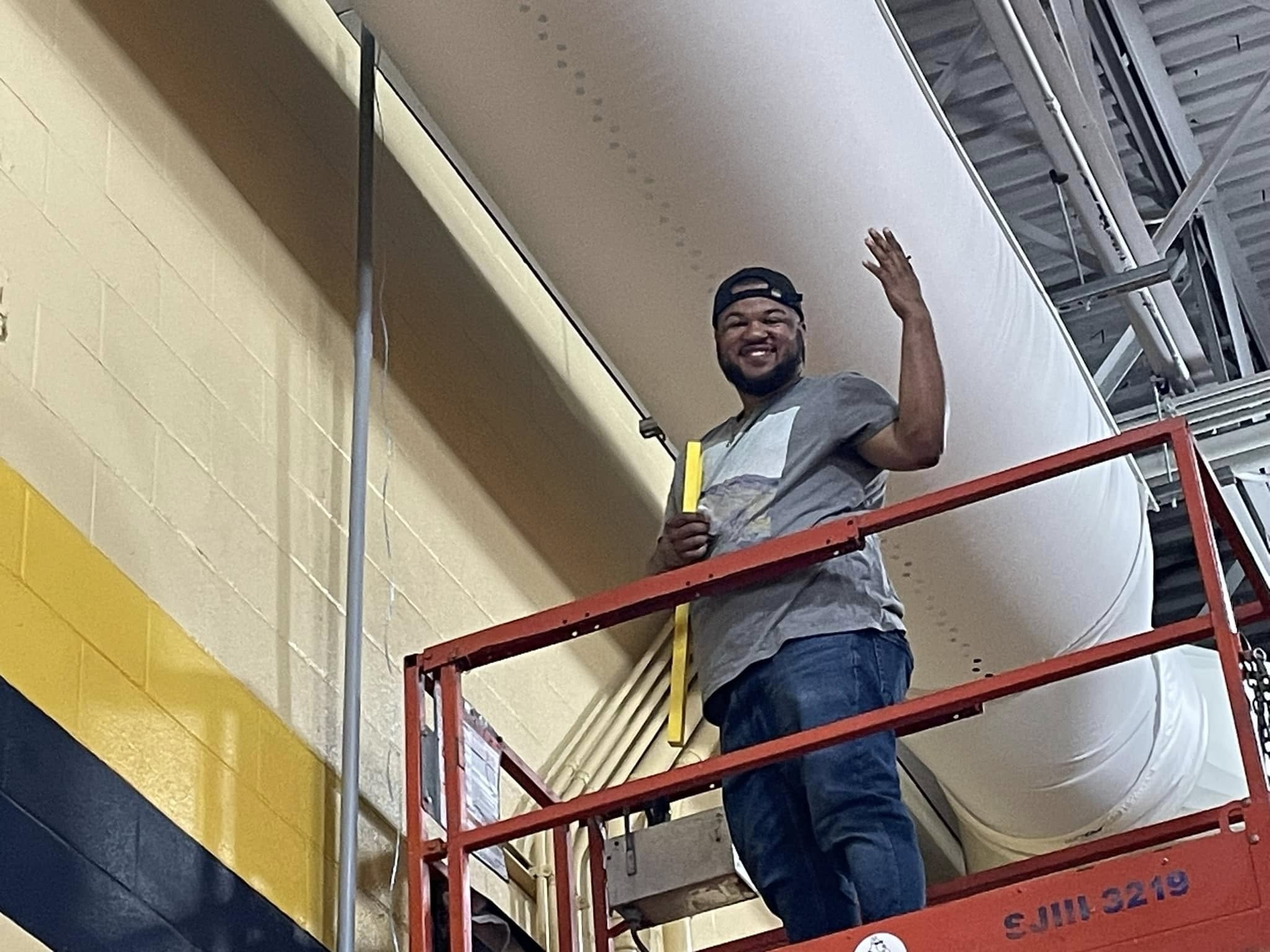 Tequila Sunrise Music technician working on a commercial A/V installation